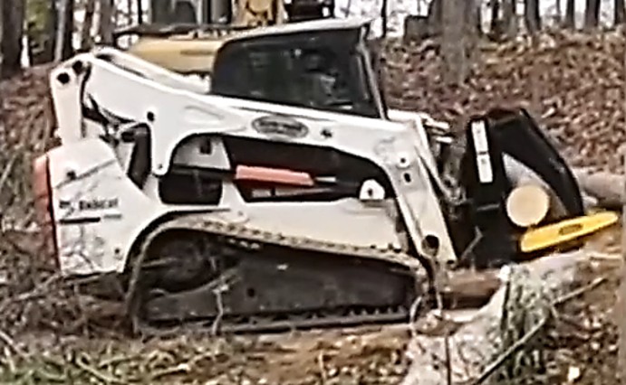 A HWP-200 GS cuts a log.