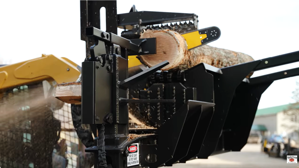 A Halverson HWP-160 firewood processing attachment cuts a log.