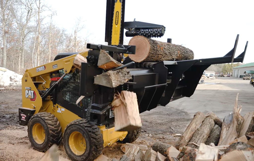 A Halverson HWP-160 firewood processing attachment splits and ejects a log.
