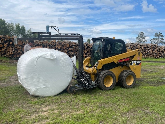 The HWP-Bale Wrapper wrapping a bale