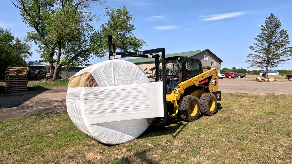 The Halverson HWP-Bale Wrapper wraps a round bale in plastic.