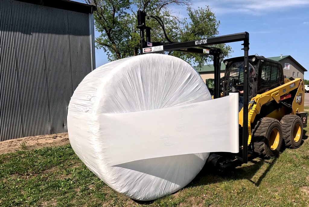 The Halverson HWP-Bale Wrapper wraps a round bale in plastic.
